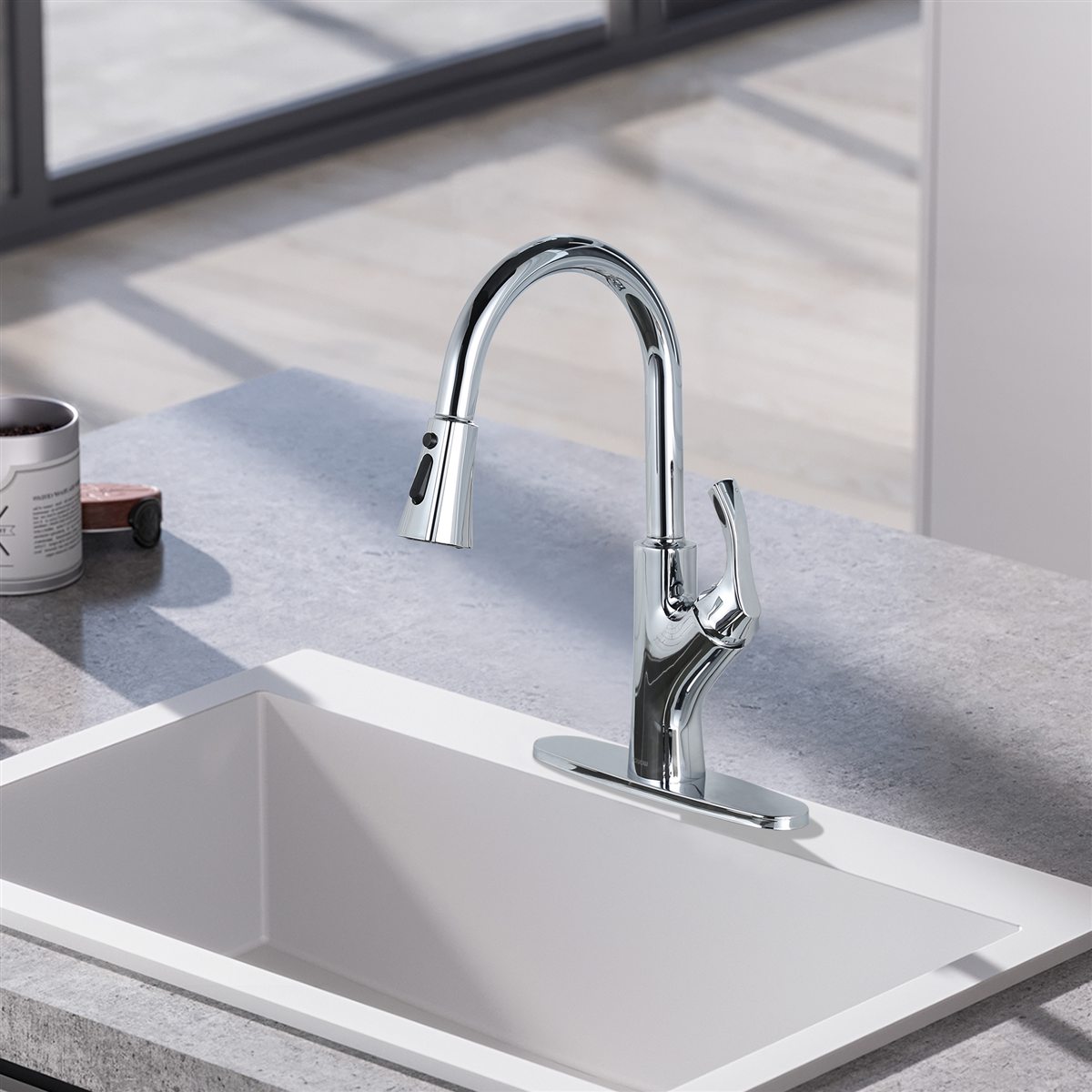 Chrome pull-down faucet on a modern kitchen sink